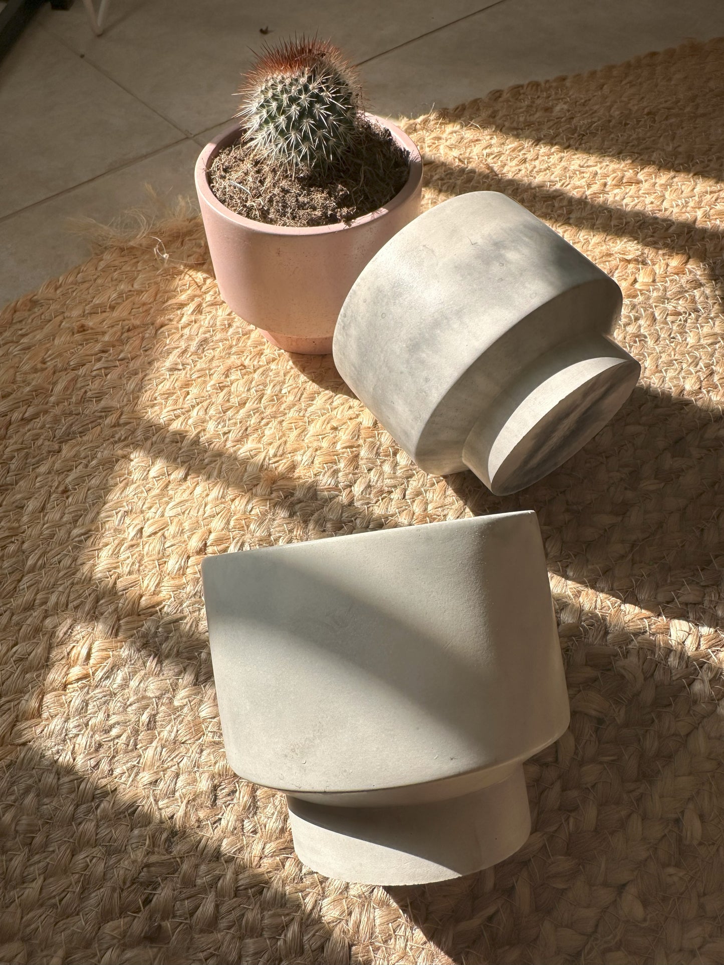 Handmade concrete planter in natural grey with marbled finish, modern minimalist design