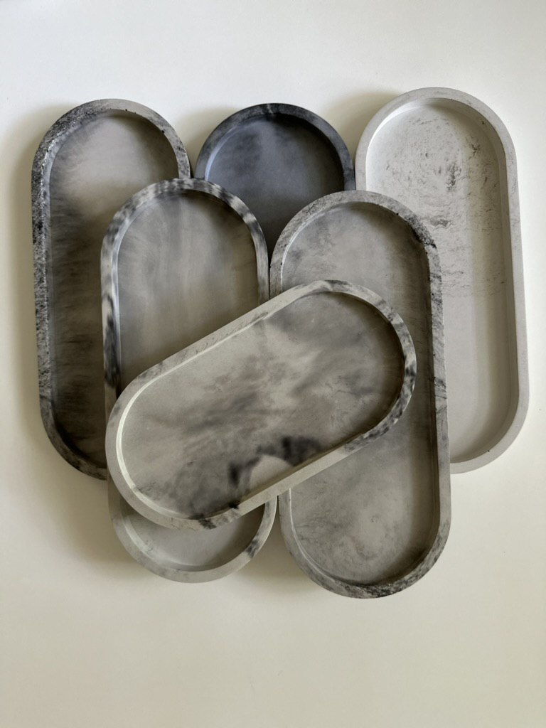 Handmade concrete tray in natural grey with marbled finish, modern minimalist design