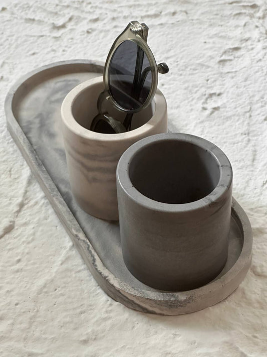 Handmade concrete set in natural grey with marbled finish, modern minimalist design