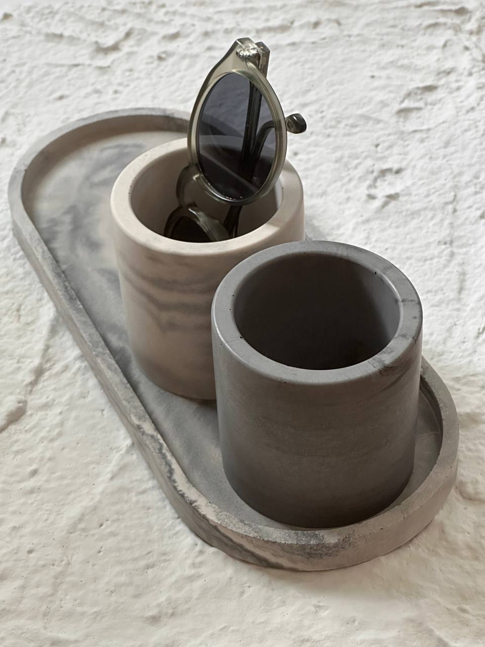 Handmade concrete set in natural grey with marbled finish, modern minimalist design